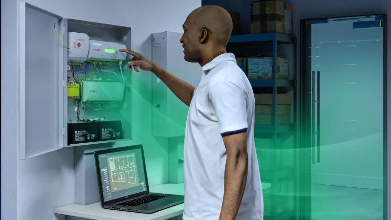 Technician configuring a Bosch access control panel