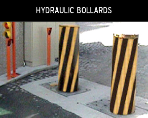 Hydraulic rising security bollards at a vehicle entrance