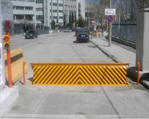 Hydraulic road blocker installed across a carriageway