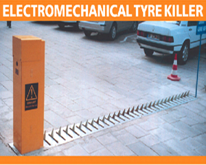 Electromechanical tyre killer installed in a road surface